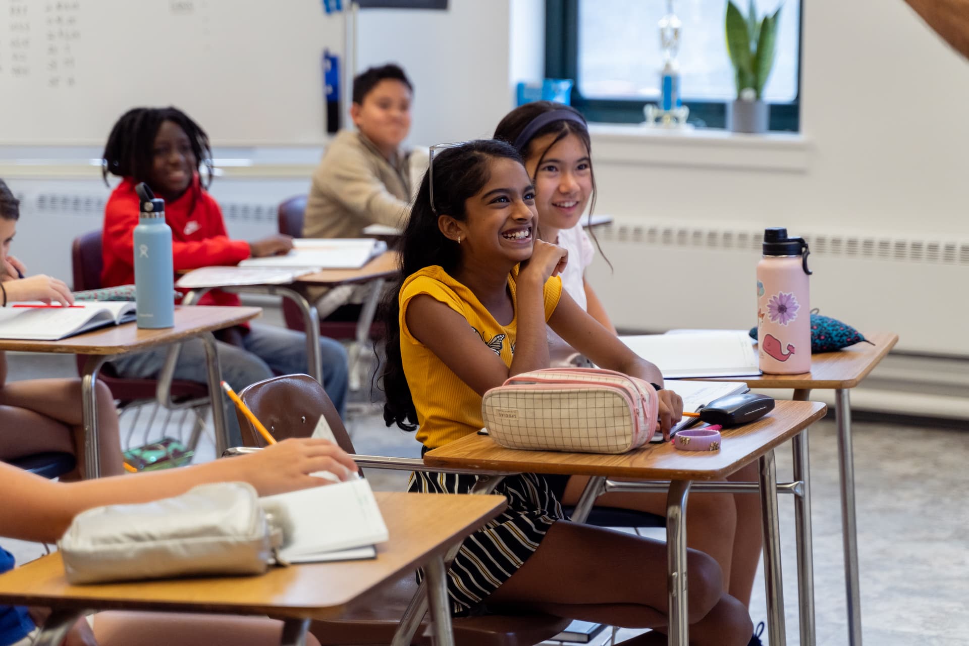 Diverse students engaged in a classroom at The Hudson School